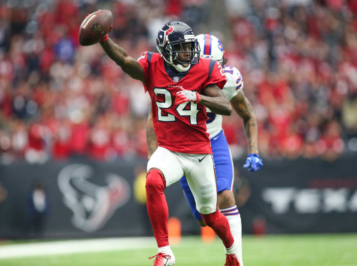Texans cornerback Johnathan Joseph (24) races toward the end zone after intercepting a pass against the Bills in 2018.